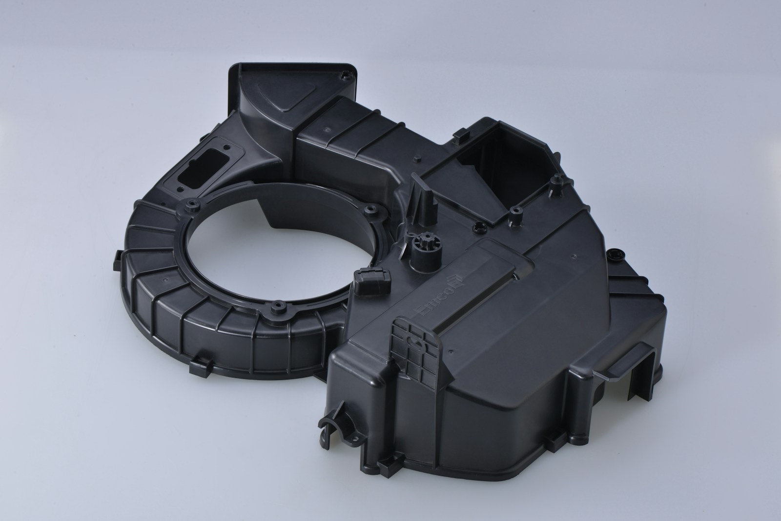 black plastic toy on white surface
