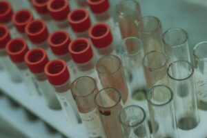 a group of beakers with red and white liquid in them